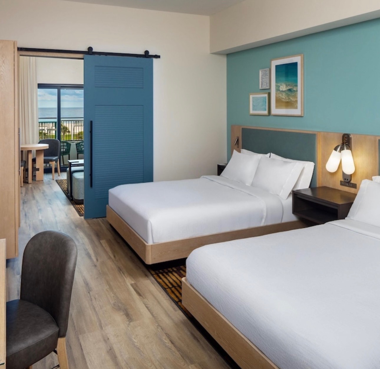 Hotel room with blue barn-style door