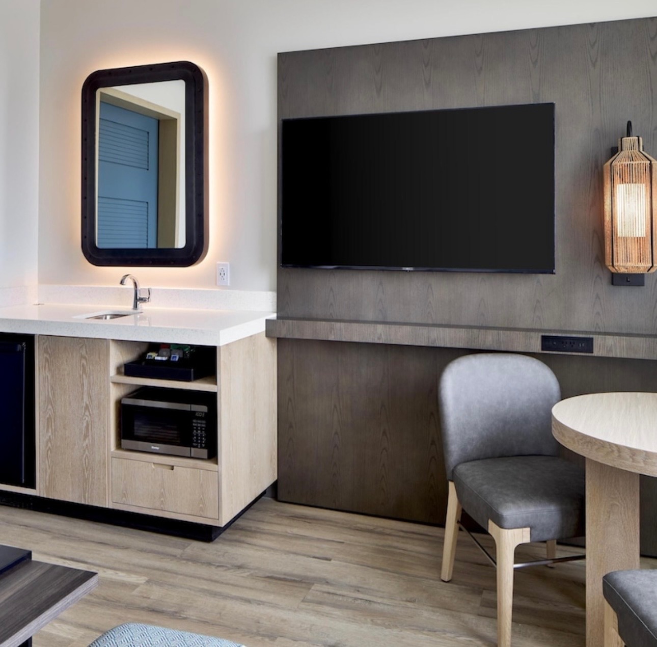 Hotel guest room TV and kitchenette